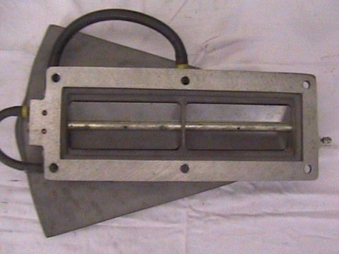 1972 Ford Ranchero - A Scott Slot injector part is shown, with a metal plate and hoses attached.