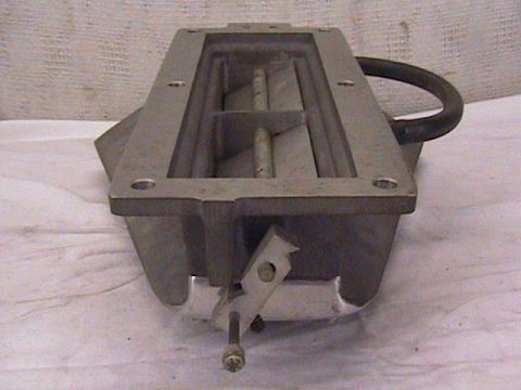 1972 Ford Ranchero - An aluminum intake manifold is shown from a top-down perspective with a black hose loop and linkage visible.