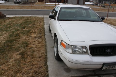 1998 Ford Crown Victoria - This 1998 Ford Crown Victoria is seen from a 3q-front angle, showing its distinctive grille and headlights. The license plate is GC-75809.