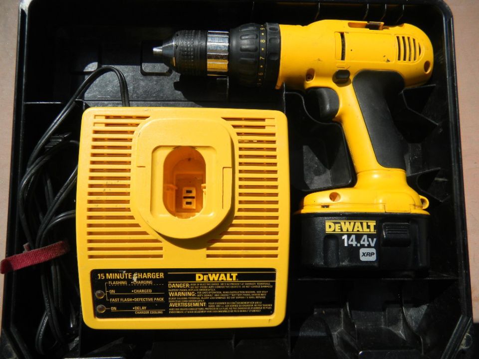 Yellow DeWalt 14.4V cordless drill and 15-minute charger in a black case