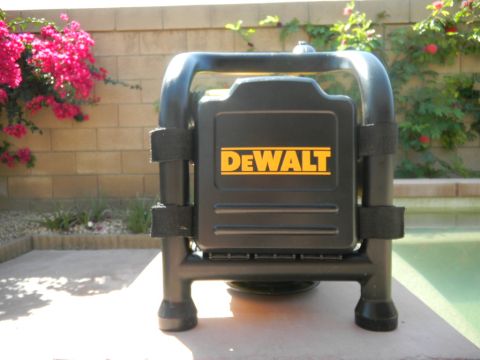 1997 Ford Ranger - A black DeWalt power tool or jobsite radio in a tubular roll-cage style frame, strapped in with two black hook-and-loop straps, sitting on…
