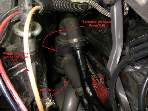 1990 Ford Bronco - Close-up view of engine components, including vacuum lines and a labeled Thermactor Air Bypass Valve.