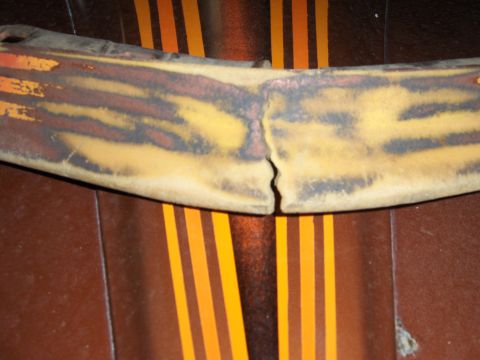 1980 Chevrolet Camaro - A damaged car part with a distinctive stripe pattern is shown close-up.