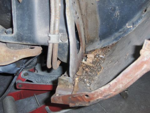 1980 Chevrolet Camaro - Debris has accumulated in the undercarriage of this vehicle, obscuring details of its structure.