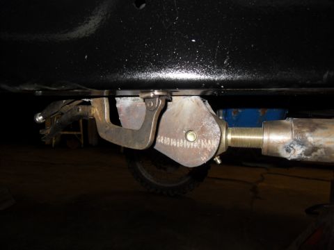 1997 Ford Ranger - A close-up view of a vehicle's undercarriage, showing a clamp securing a part.