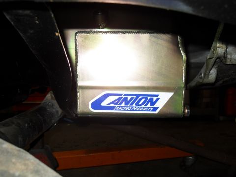 1997 Ford Ranger - Close-up of a vehicle's underbody skid plate a "CANION RACING PRODUCTS" sticker.