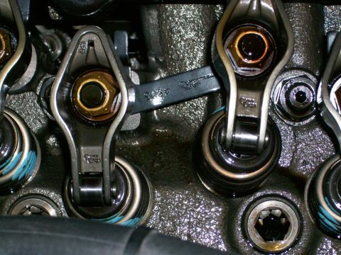 1973 Ford Ranchero - Close-up view of an engine's valve train components, showing rocker arms and fasteners.