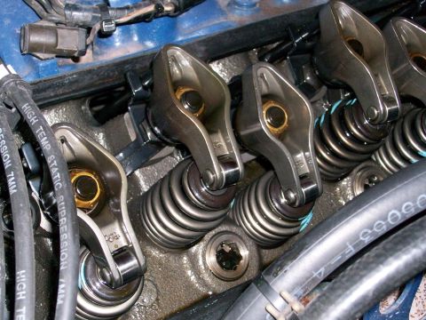 1973 Ford Ranchero - Close-up view of the engine's valve train, showing rocker arms and valve springs.