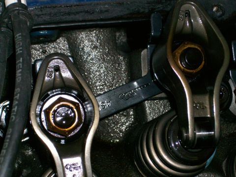 1973 Ford Ranchero - Engine valve train components, including rocker arms and springs, with a wrench in view. A '172' stamp is visible.