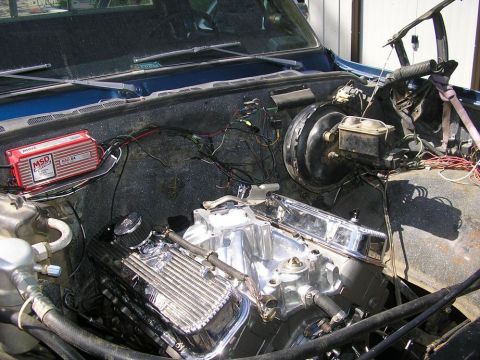1979 Chevrolet C/K Pickup - Custom V8 engine installation in a vehicle's engine bay, aftermarket parts.
