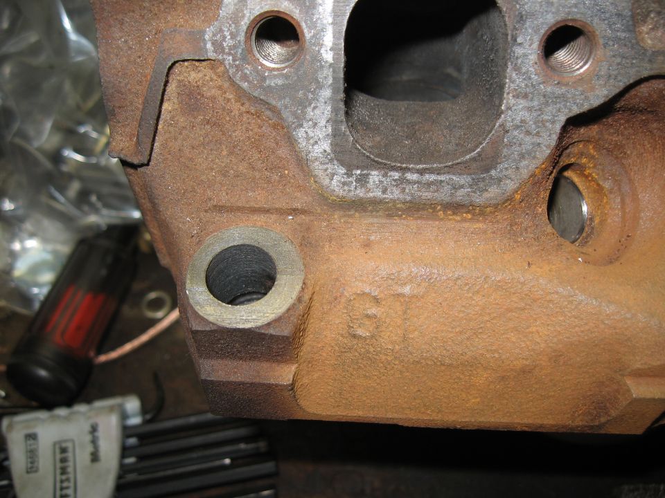 Engine part with 'GT' marking