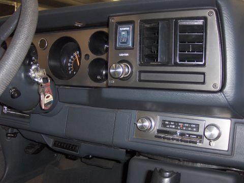 1979 Chevrolet Camaro - Interior view of a 1979 Chevrolet Camaro dashboard, showing the instrument cluster, radio, and steering column with keys.