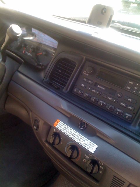 2009 Ford Crown Victoria - Interior view of a 2009 Ford Crown Victoria, showing the dashboard, radio, and climate controls.