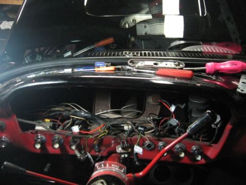 1966 Ford F-100 - Dashboard wiring and controls of a 1966 Ford F-100, possibly during a repaint or repair.
