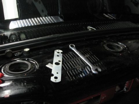 1966 Ford F-100 - Tools are laid out on the dashboard of a vehicle, suggesting ongoing work or repair.