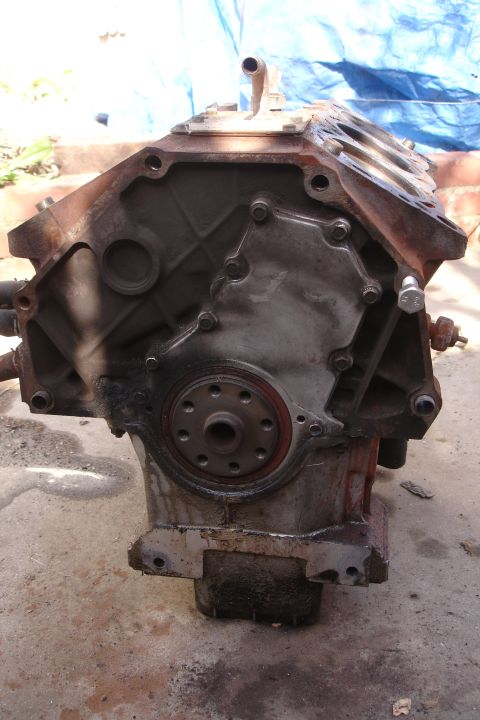 1993 Ford Taurus - Engine block shown from the side, with visible rust and a red seal on the crankshaft flange.