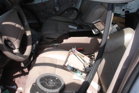 1993 Ford Taurus - The interior of a 1993 Ford Taurus shows signs of significant disrepair and modification.