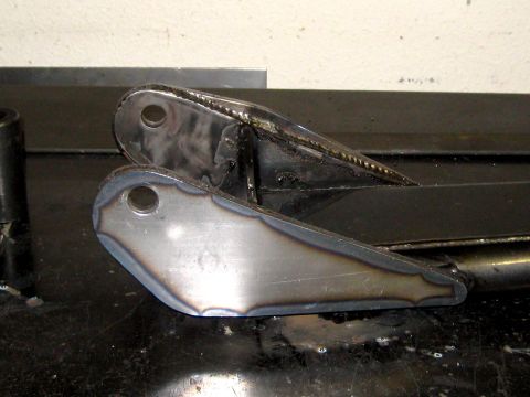 1996 Ford Bronco - Close-up of custom-welded metal brackets, possibly for a vehicle's suspension system.