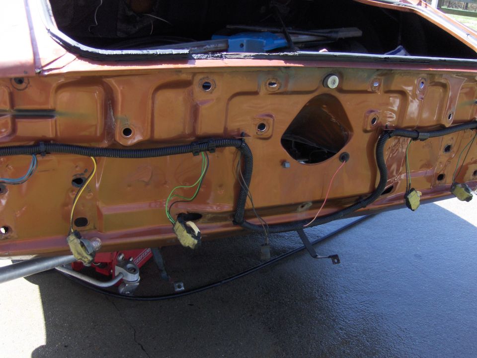 1980 Chevrolet Camaro trunk interior showing wiring harness and mounting points