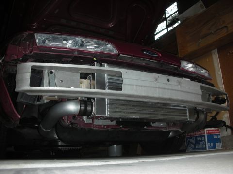 1992 Ford Crown Victoria - Front view of a 1992 Ford Crown Victoria showing a custom intercooler installation behind the bumper.