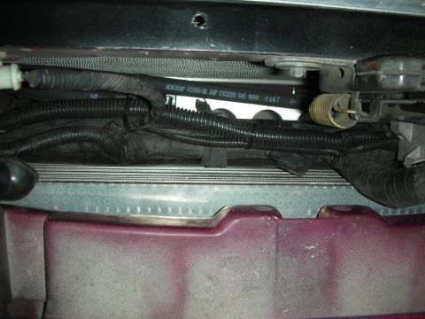 1992 Ford Crown Victoria - Close-up view of wiring and radiator components in an engine bay.