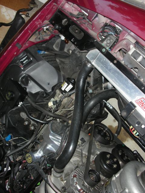 1992 Ford Crown Victoria - Custom intercooler installation in a vehicle's engine bay, showing modified components and wiring.