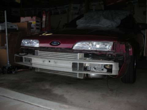 1992 Ford Crown Victoria - Front view of a 1992 Ford Crown Victoria undergoing modifications, an exposed intercooler and removed bumper.