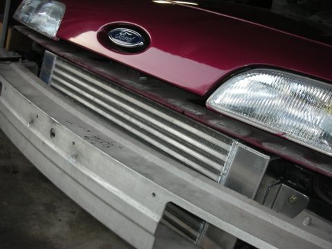 1992 Ford Crown Victoria - Aftermarket intercooler installed on the front of a Ford vehicle.