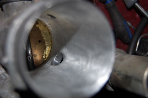 1994 Ford Bronco - Interior view of a throttle body, likely after porting or polishing.