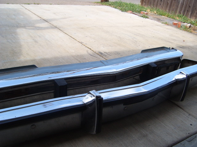 Chrome bumper with black trim and rubber guards