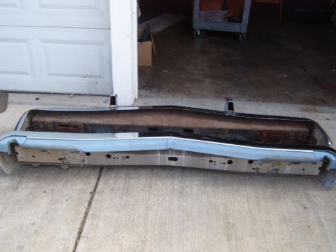 1973 Ford Ranchero - Front bumper assembly with chrome trim and rusty inner support, likely from an older vehicle.