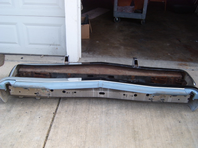 Front bumper assembly, light blue painted section, chrome trim, rusty inner support