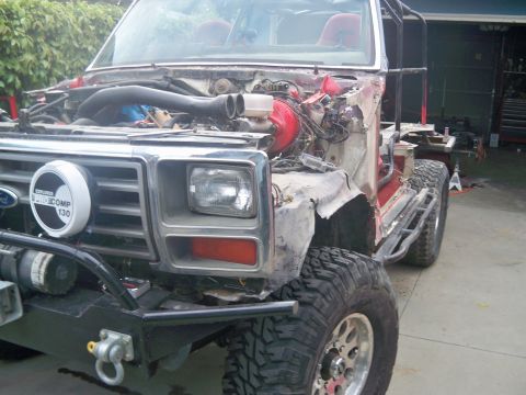 1985 Ford Bronco - This heavily modified Ford Bronco shows significant disassembly, suggesting a rebuild or repair process.