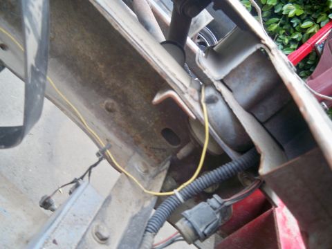 1985 Ford Bronco - Detail of vehicle frame and wiring harness, likely from a restoration project.