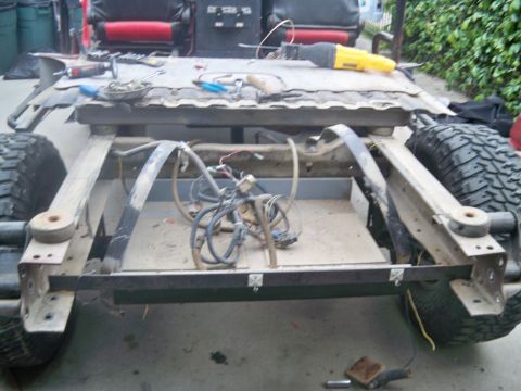 1985 Ford Bronco - This is a disassembled vehicle frame, possibly undergoing restoration or modification.