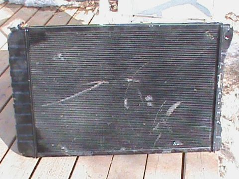 1979 Chevrolet Blazer - A used radiator is shown from the front, with visible damage to its fins.