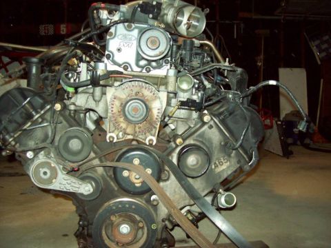 1993 Ford Crown Victoria - Close-up view of an engine assembly, an SVT badge and a visible serial number.