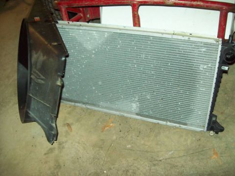 1993 Ford Crown Victoria - Vehicle radiator and fan shroud components shown removed from the car.