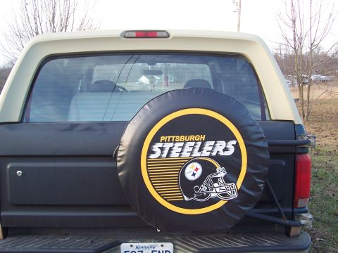 1984 Ford Bronco - This 1984 Ford Bronco features a spare tire cover adorned with the Pittsburgh Steelers logo and helmet.