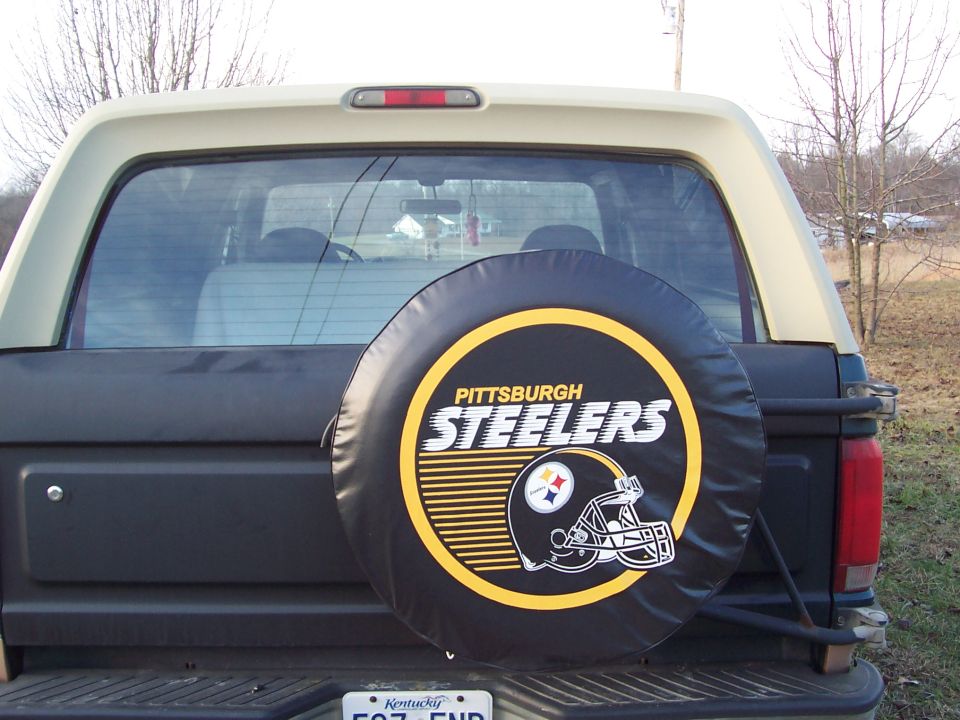 Rear view of a 1984 Ford Bronco with a Pittsburgh Steelers spare tire cover