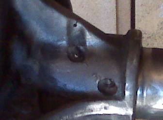 1983 Ford Bronco - i drilled a little hole to show how far the crack went and so it dont go any farther. the 2 plug welds chipped. the top one has a small pie…