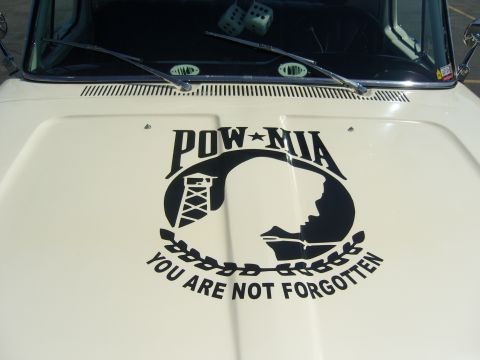 2007 Ford Mustang - Decal on vehicle hood reads "POW-MIA YOU ARE NOT FORGOTTEN" with silhouette imagery.