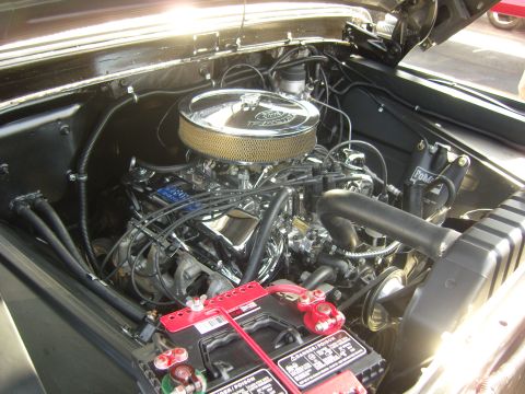 2007 Ford Mustang - Engine bay details of a Ford V8 with a chrome air cleaner and visible battery.
