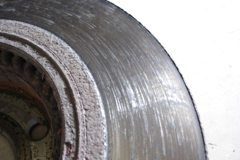 2006 Ford Fusion - This brake rotor shows significant wear and scoring, indicating it needs replacement.