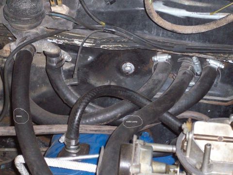 1969 Ford Torino - Close-up view of hoses and engine components within a vehicle's engine bay.