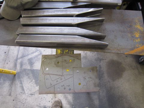 1996 Ford Bronco - Metal pieces are prepared for fabrication, with markings indicating placement and orientation.