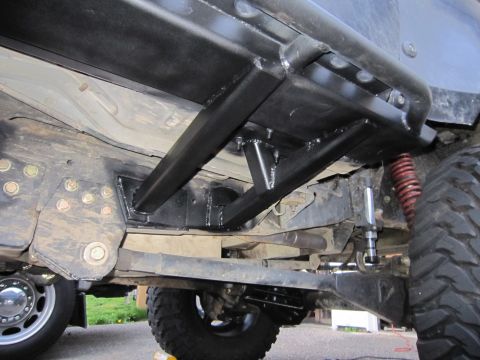 1996 Ford Bronco - Aftermarket rock sliders and suspension components are visible on the underbody of this vehicle.