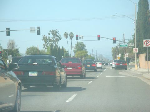 1995 Ford Taurus - Driving in traffic on a sunny day, with a 1995 Ford Taurus in front.
