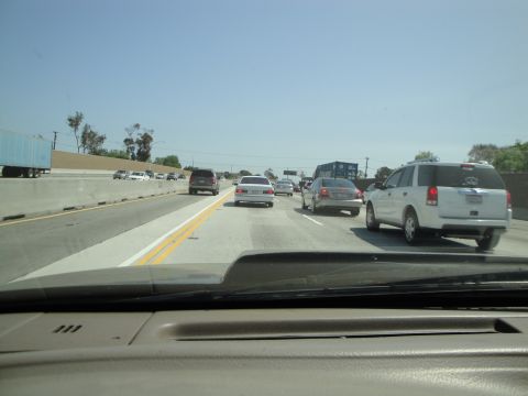 1995 Ford Taurus - Driving in traffic on a sunny day on the highway.