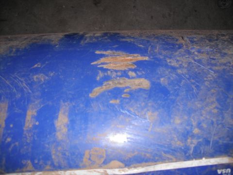 1991 Ford Bronco - Close-up of a blue plastic part showing wear and tear.